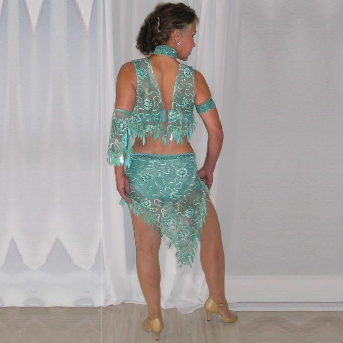 Crysta's Creations back view of Gorgeous aqua Latin/rhythm two piece dance dress created of gorgeous aqua soutache lace fabric, embellished with about 10 gross of Aqua AB Swarovski stones with lots of hand beading & paillettes.