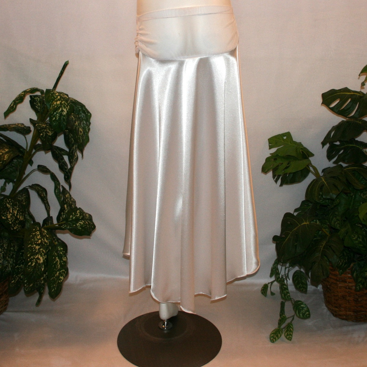 back view of White dance skirt created of white stretch satin is waltz length, being a bit longer in the back with a scalloped hem.