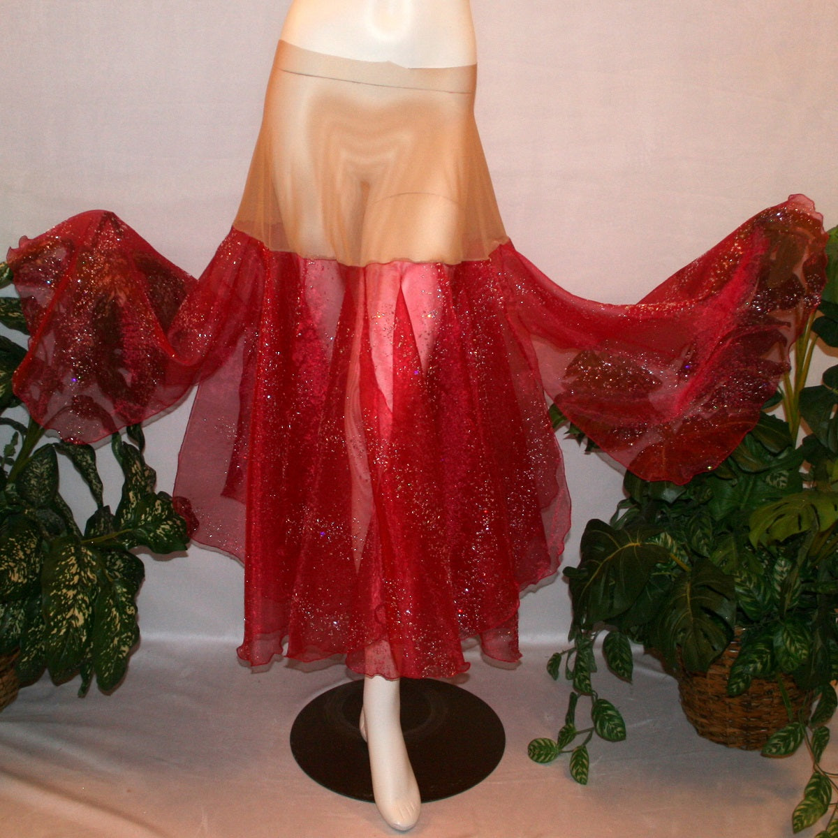 flaired view of Red ballroom skirt created on a nude illusion hip band of yards of scarlette red panels with silver & pearlized flecking, very cool & showy!