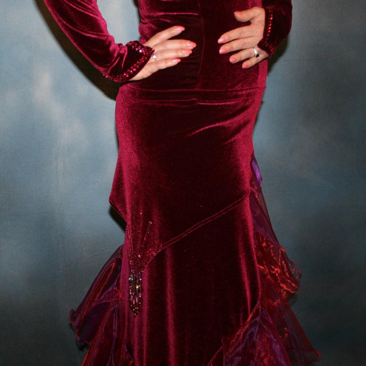 Crystal's Creations lower right view of Burgundy tango dress created in luxurious burgundy stretch velvet, with flounces of iridescent burgundy organza, adorned with fuchsia Swarovski rhinestones, hip sash has Swarovski hand beading as well, just recently embellished more.