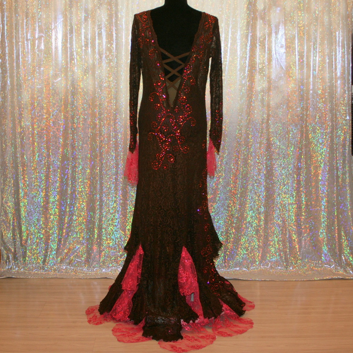 back view of Brown lace tango dress, paso dresss, or fabulous bolero dress or rumba dress created in luxurious chocolate brown stretch lace with accent flounces of a deep pink glitter lace, embellished with Swarovski rhinestone detail work in Indian pink, mocha,copper & fuschia.