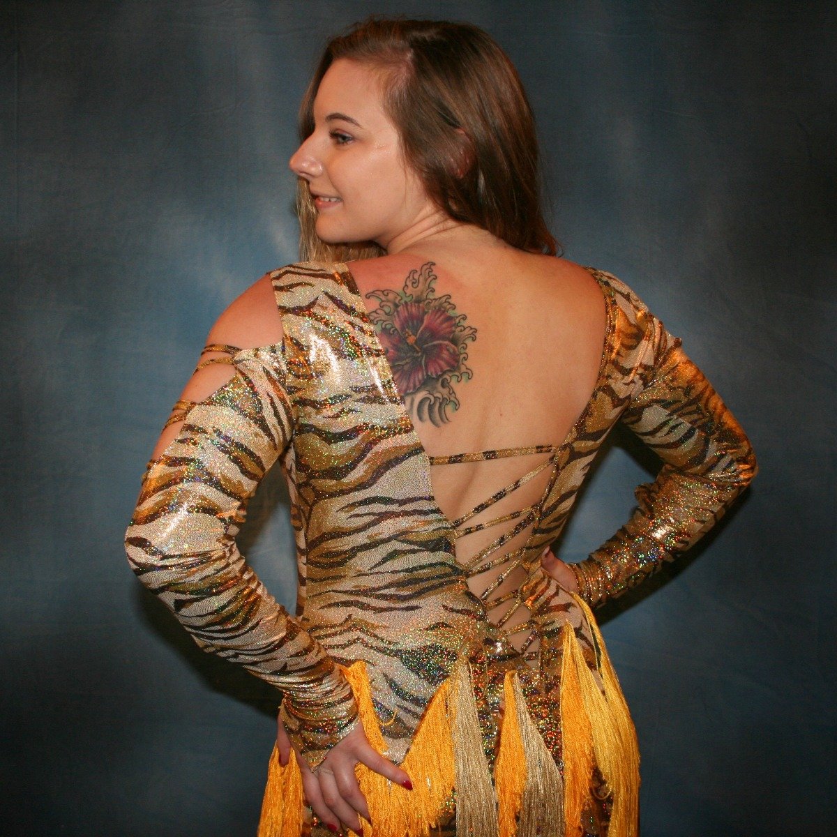 Crystal's Creations close up back view of gold hologram tiger print Latin/rhythm dress with fringe size 5/6-9/10
