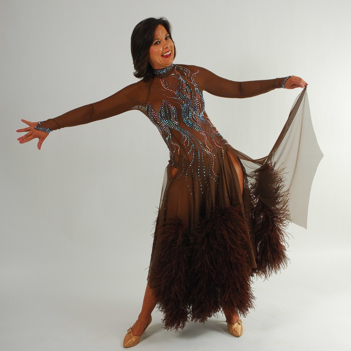 Crystal's Creations brown ballroom dress created of brown sheer mesh illusion with detailed Swarovski rhinestone work in aqua Abs & brown ostrich feathers