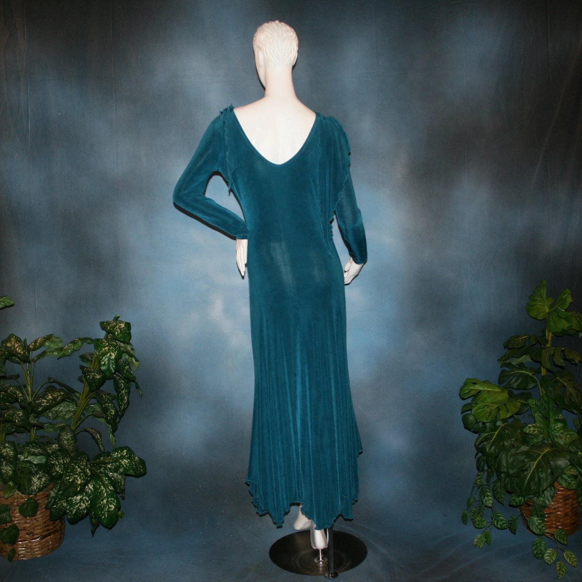 back view of Blue social ballroom dress created in deep blue luxurious solid slinky fabric with attached draping on shoulders & scalloped skirt edge. Very full around bottom & can be a beginner ballroom dancer smooth dress.