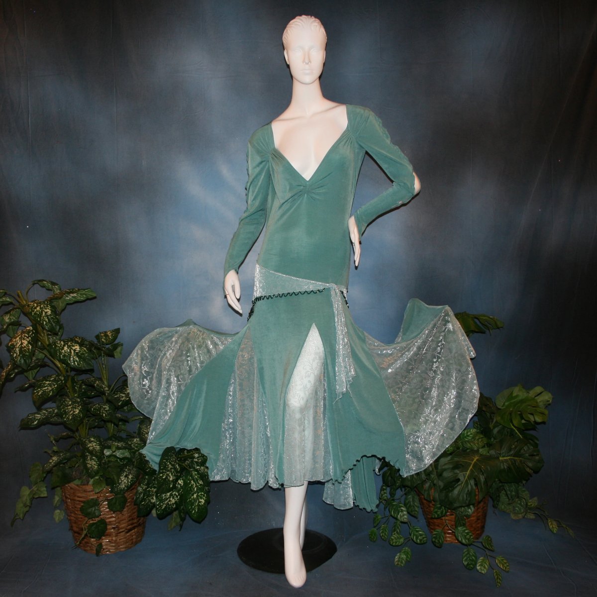 Aqua social ballroom dress created in luxurious aqua solid slinky fabric with aqua iridescent sheer insets, embellished with hand beading of Swarovski beads on hip sash. Very full around bottom...can be a beginner ballroom dancer smooth ballroom dress.