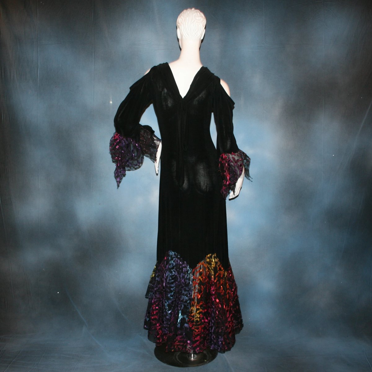 back view of Black social ballroom dress created in luxurious black solid slinky fabric with yards of gorgeous rainbow colorful & textured sheer fabric. A great social dress for any special occasion, as well as a great beginner ballroom show dress!