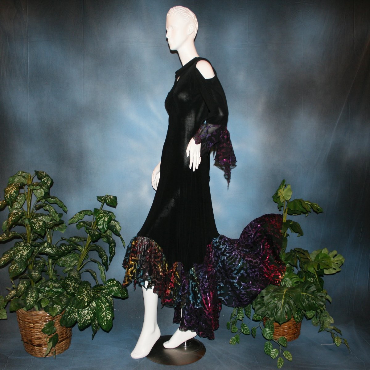 side view of Black social ballroom dress created in luxurious black solid slinky fabric with yards of gorgeous rainbow colorful & textured sheer fabric. A great social dress for any special occasion, as well as a great beginner ballroom show dress!
