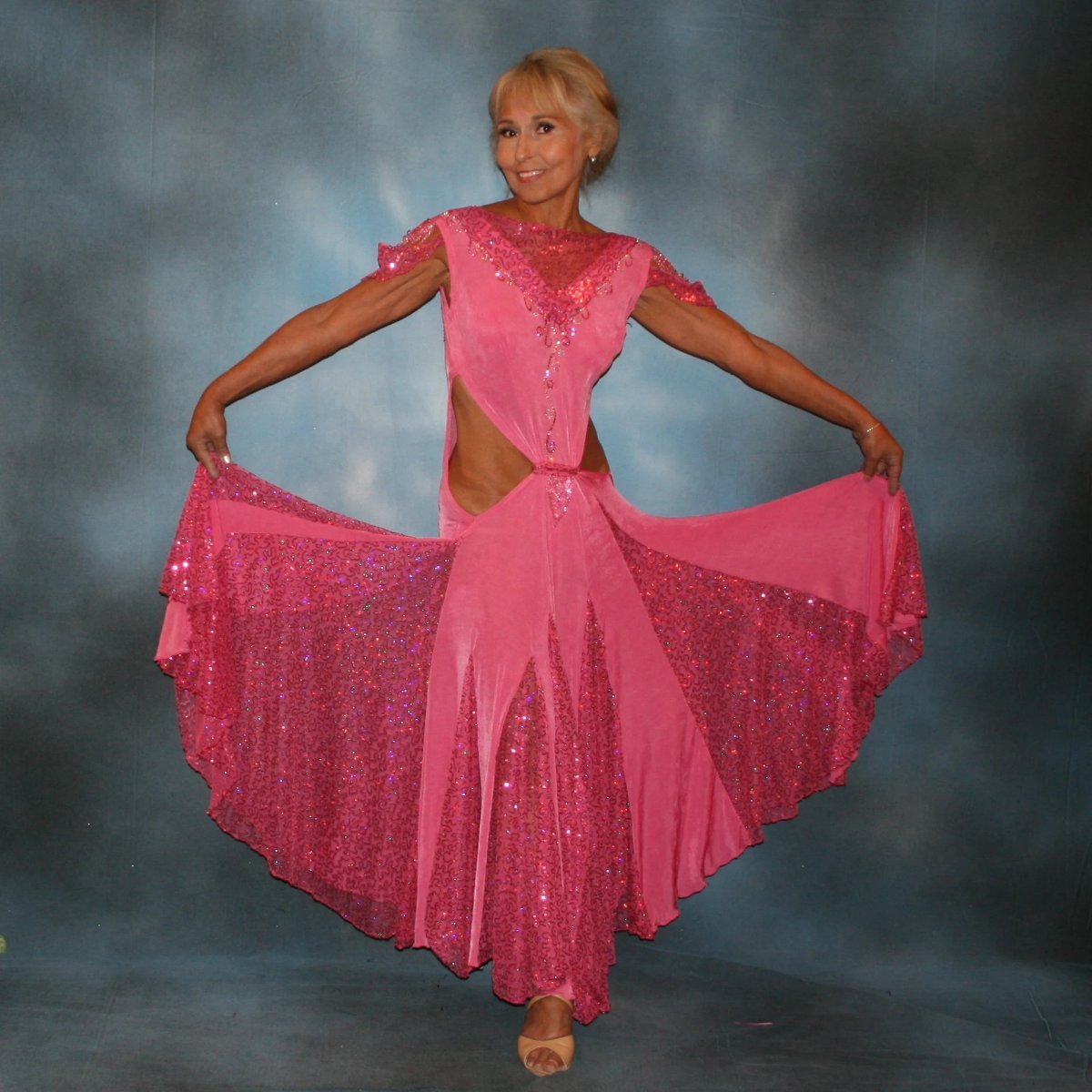 Crystal's Creations Pink ballroom dress was created of luxurious bubble gum pink solid slinky with yards & yards of delicate deep pink sequin insets & is embellished with CAB & rose Swarovski detailed rhinestone work
