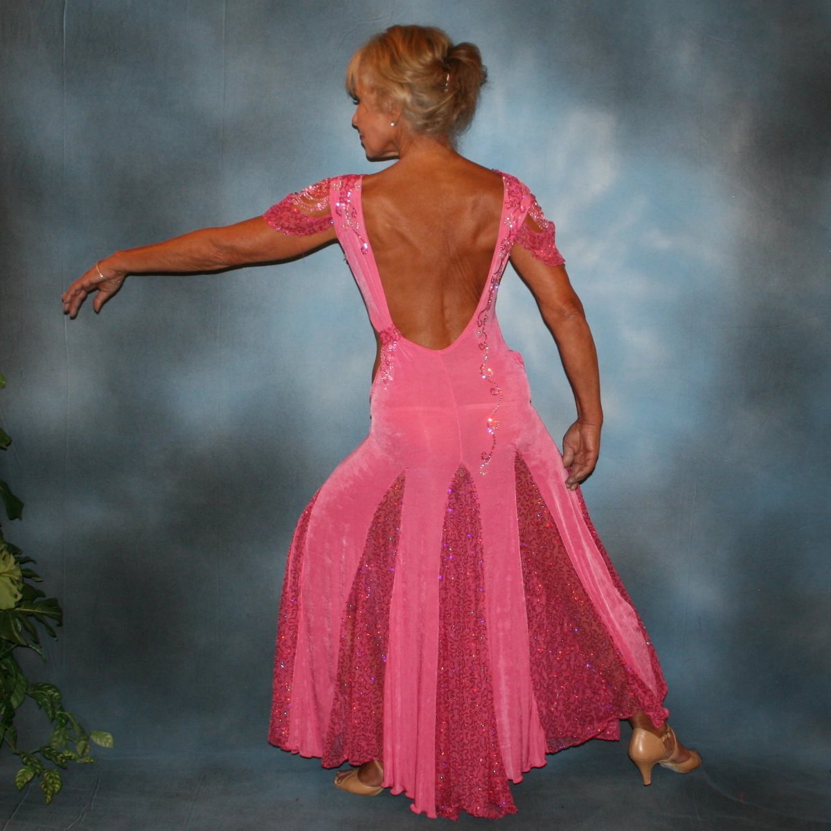 Crystal's Creations back view of Pink ballroom dress was created of luxurious bubble gum pink solid slinky with yards & yards of delicate deep pink sequin insets & is embellished with CAB & rose Swarovski detailed rhinestone work