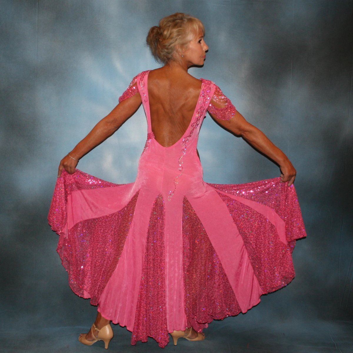 Crystal's Creations back view of Pink ballroom dress was created of luxurious bubble gum pink solid slinky with yards & yards of delicate deep pink sequin insets & is embellished with CAB & rose Swarovski detailed rhinestone work