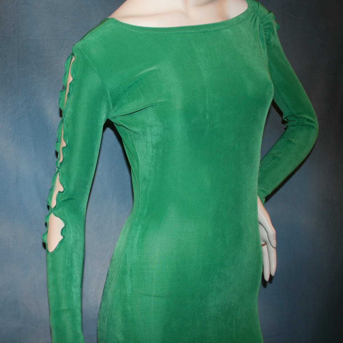 close upper view of Gorgeous green ballroom dress created in luxurious solid slinky fabric with printed chiffon of greens, with gold accents insets. Very full around bottom...can be a beginner ballroom dancer smooth or standard dress.