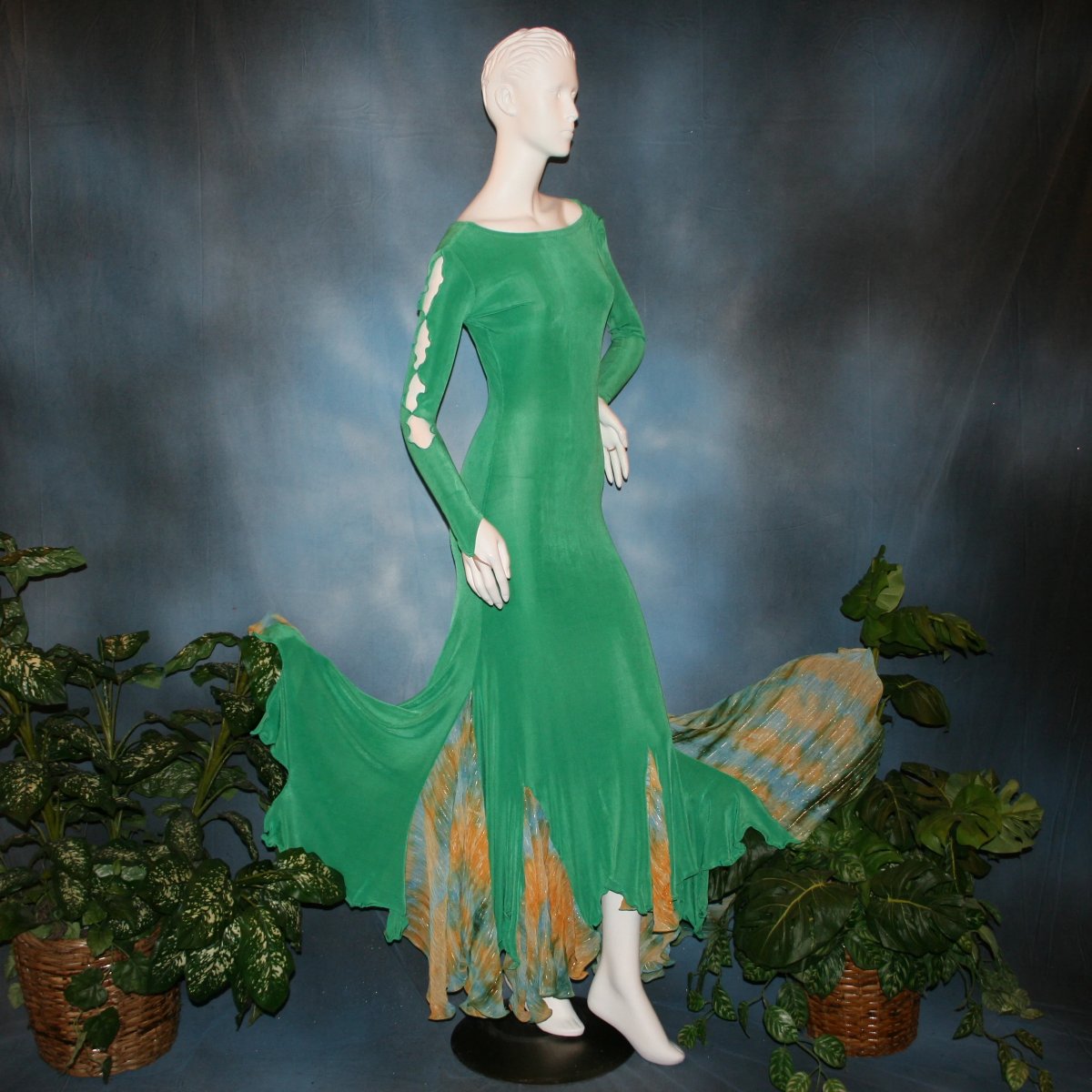 side view of Gorgeous green ballroom dress created in luxurious solid slinky fabric with printed chiffon of greens, with gold accents insets. Very full around bottom...can be a beginner ballroom dancer smooth or standard dress.
