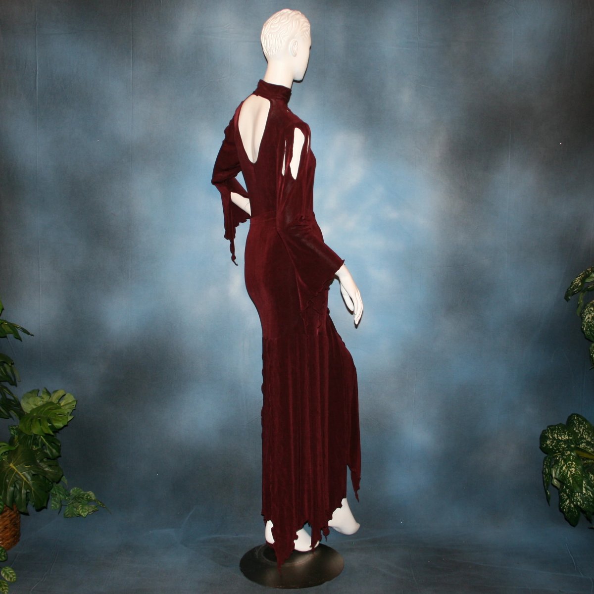 side back view of Burgundy sarong style Latin/rhythm paneled skirt, matching bodysuit featuring flared arms with cutout details created of luxurious burgundy solid slinky. Great for any ballroom dance, ballroom dance teachers or social event!