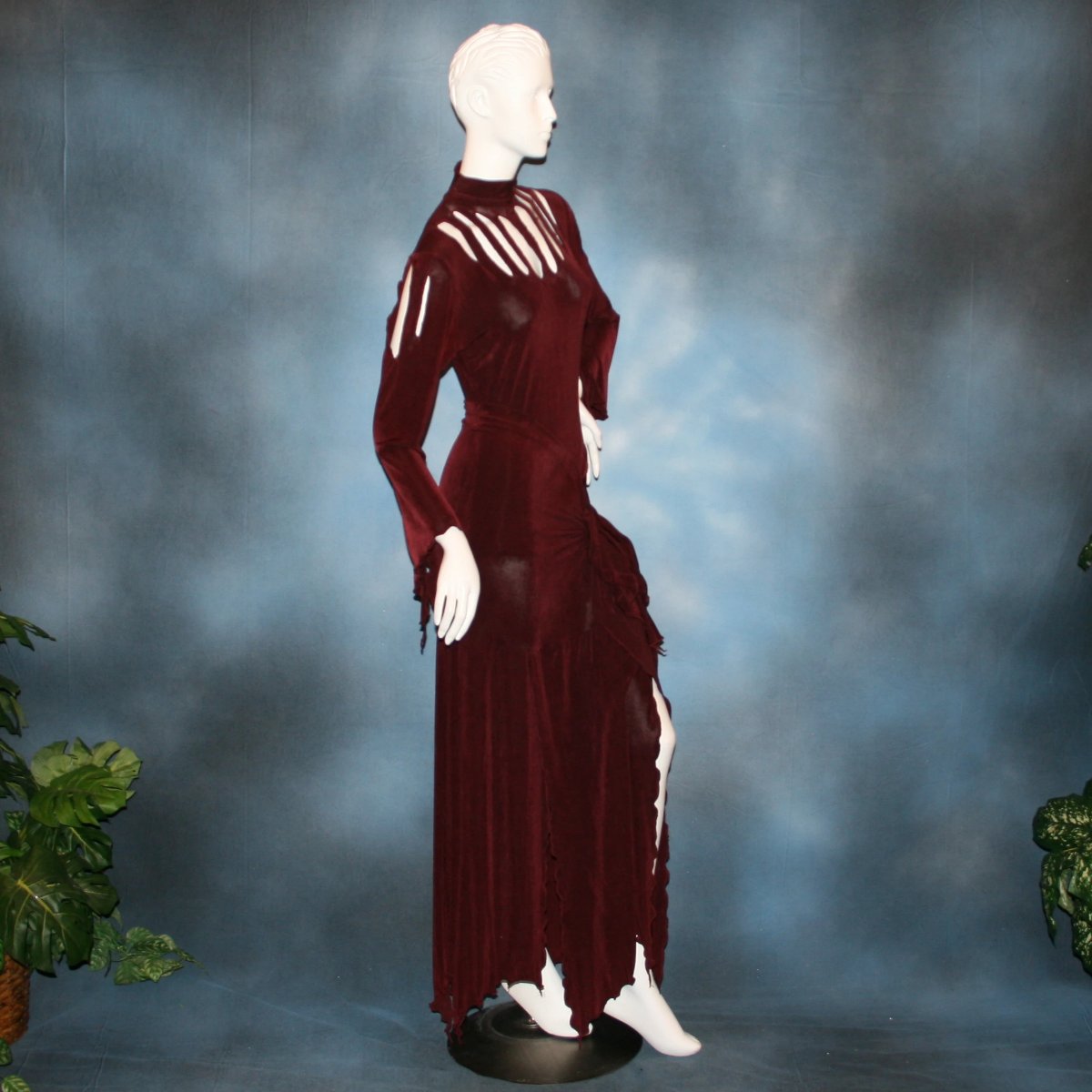 side view of Burgundy sarong style Latin/rhythm paneled skirt, matching bodysuit featuring flared arms with cutout details created of luxurious burgundy solid slinky. Great for any ballroom dance, ballroom dance teachers or social event!