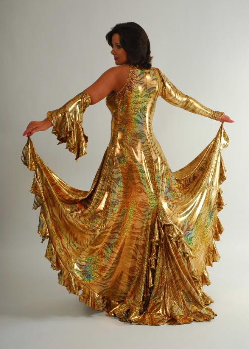 Crystal's Creations back view of Gold tango/paso-doble dress created of gold iridescent hologram tiger print lycra features lots of flounces & is embellished with special volcano colored Swarovski rhinestone work size 5/6-9/10