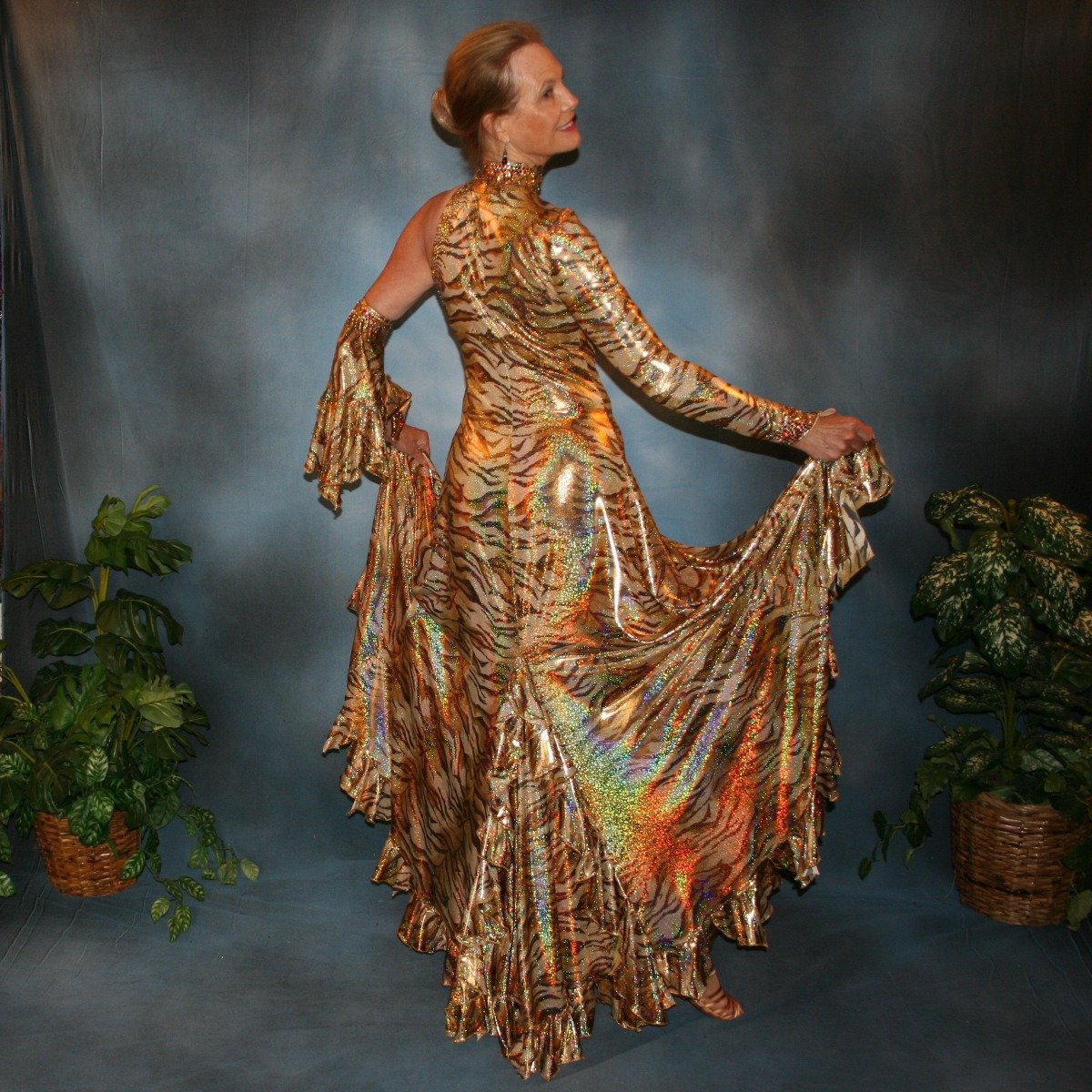 Crystal's Creations right back side of gold hologram tiger print tango dress with many flounces & volcano colored Swarovski rhinestone work size 5/6-9/10