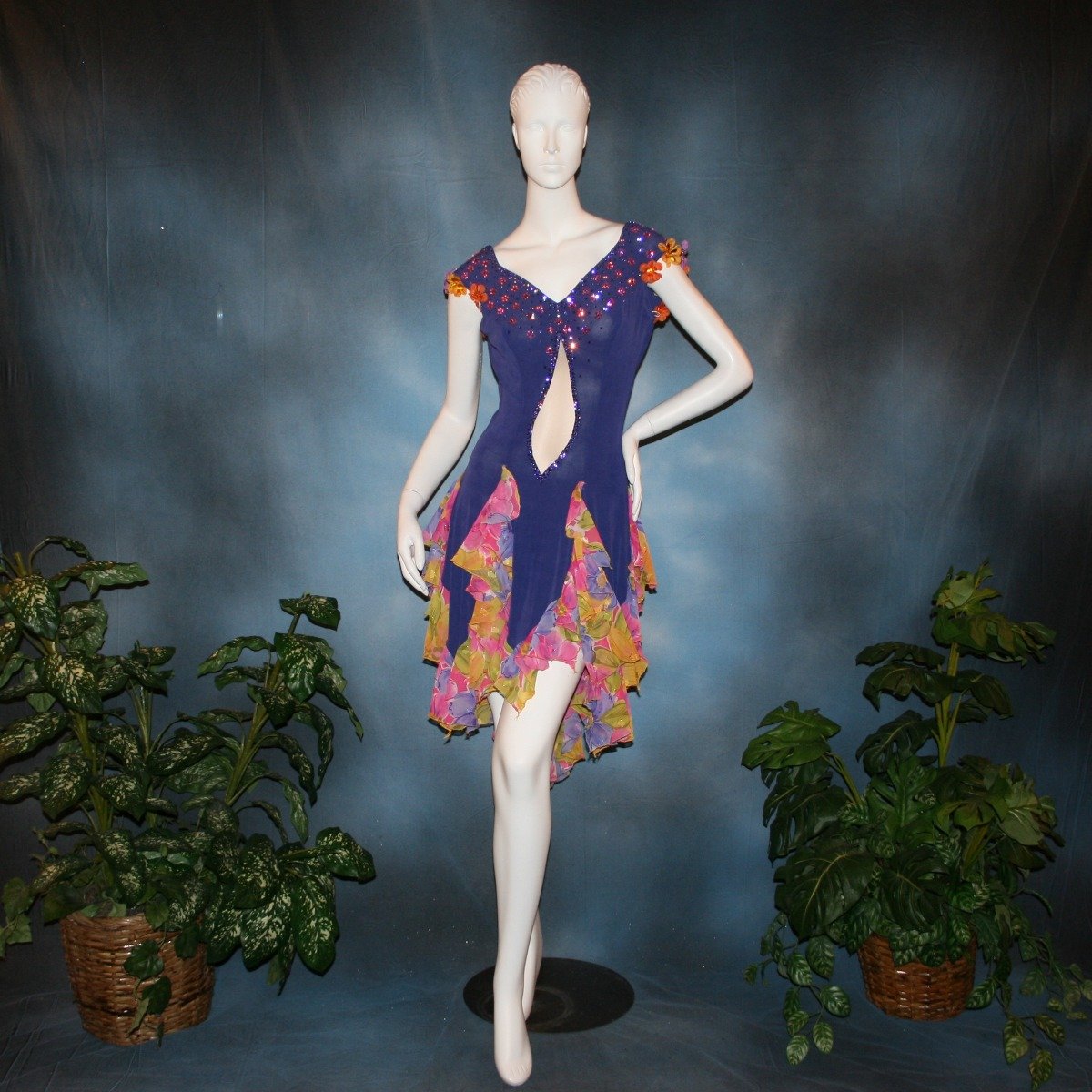 Crystal's Creations Converta ballroom dress featuring a Latin/rhythm dress created in luxurious deep perwinkle solid slinky with lots of flounces in accents of a floral chiffon in yellow with pinks & purples