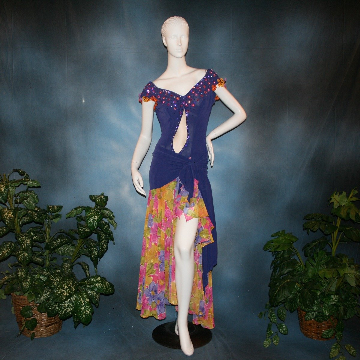 Crystal's Creations Converta ballroom dress featuring a Latin dress created in luxurious deep perwinkle solid slinky with lots of flounces in accents of a floral chiffon in yellow with pinks & purples