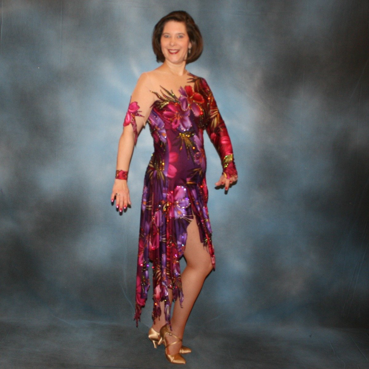 Crystal's Creations Tropical print Latin/rhythm dress created in tropical print lycra in burgundies & purples on a nude illusion base, embellished lavishly with Swarovski rhinestone work in burgundies, purples, orchids & a touch of the greens & golds that are within the print.