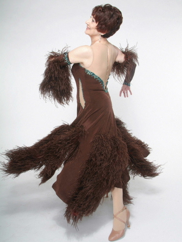 Crystal's Creations side view of brown ballroom dress with feathers