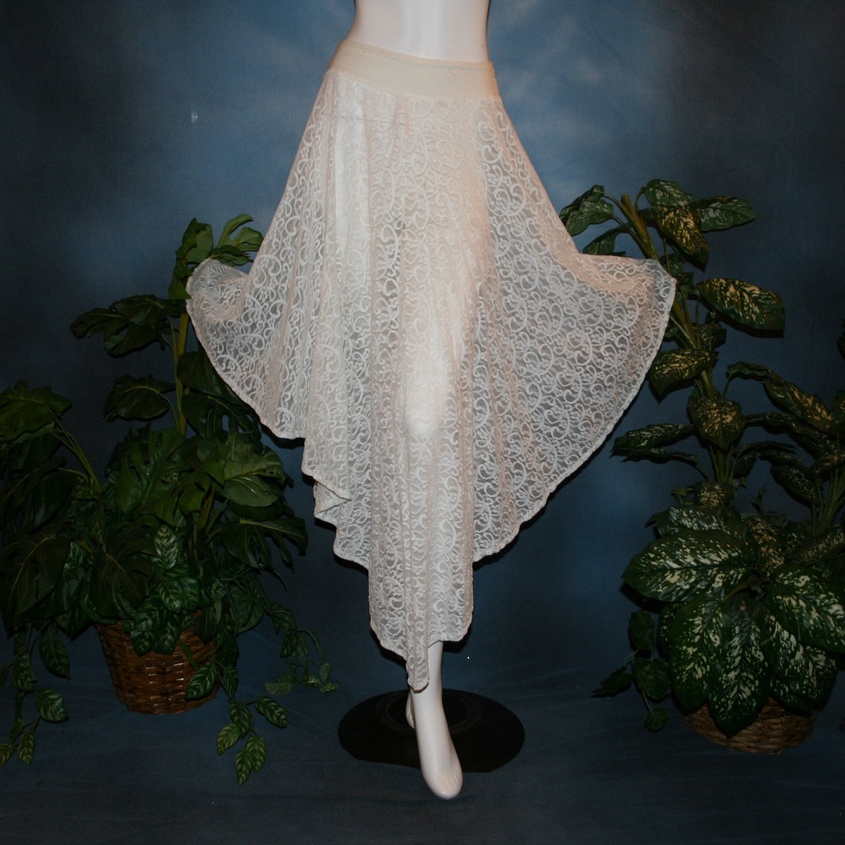 slightly flared view of white ballroom skirt crafted from stunning stretch lace features an extra full, waltzing length design and is slightly shorter on the sides.