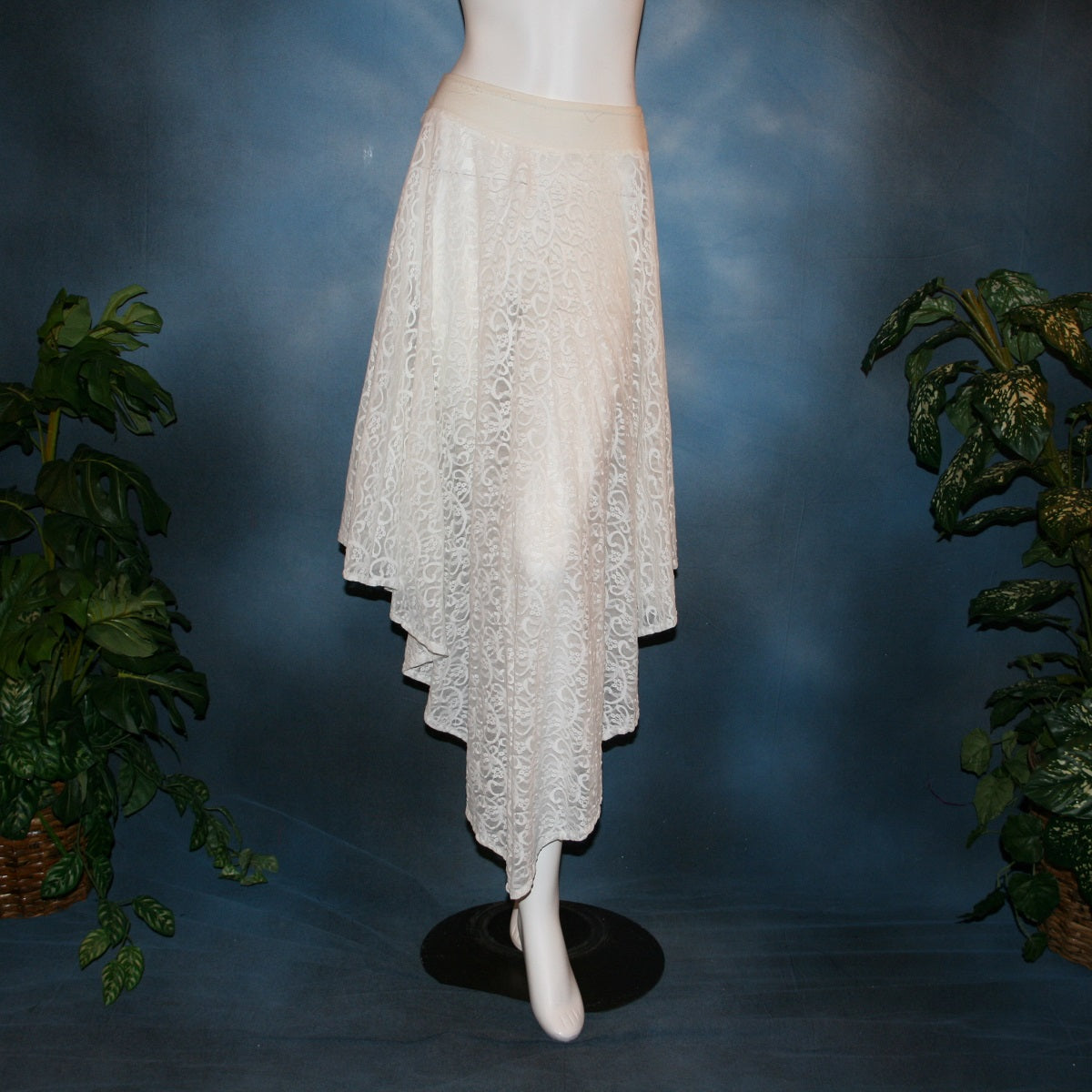 white ballroom skirt crafted from stunning stretch lace features an extra full, waltzing length design and is slightly shorter on the sides. 