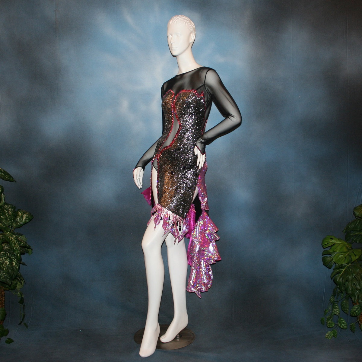 Crystal's Creations left front view of Black & silver Latin/rhythm dress with pink accents created of gorgeous silver swirls on black glitter slinky on a sheer stretch mesh base, embellished with pink Swarovski rhinestone work & hand beading