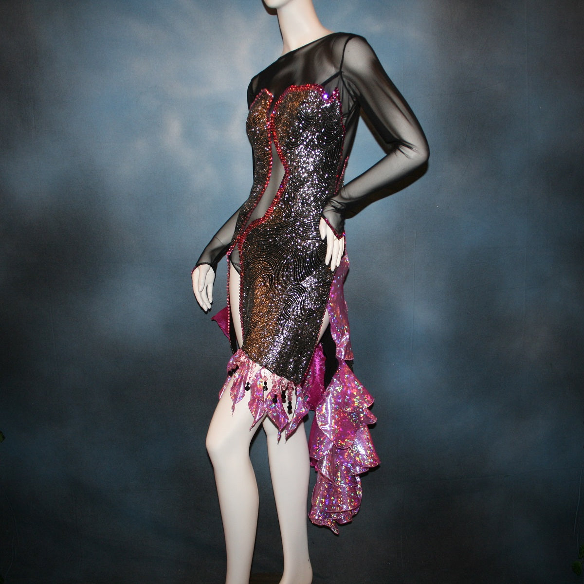 Crystal's Creations close left side front view of Black & silver Latin/rhythm dress with pink accents created of gorgeous silver swirls on black glitter slinky on a sheer stretch mesh base, embellished with pink Swarovski rhinestone work & hand beading