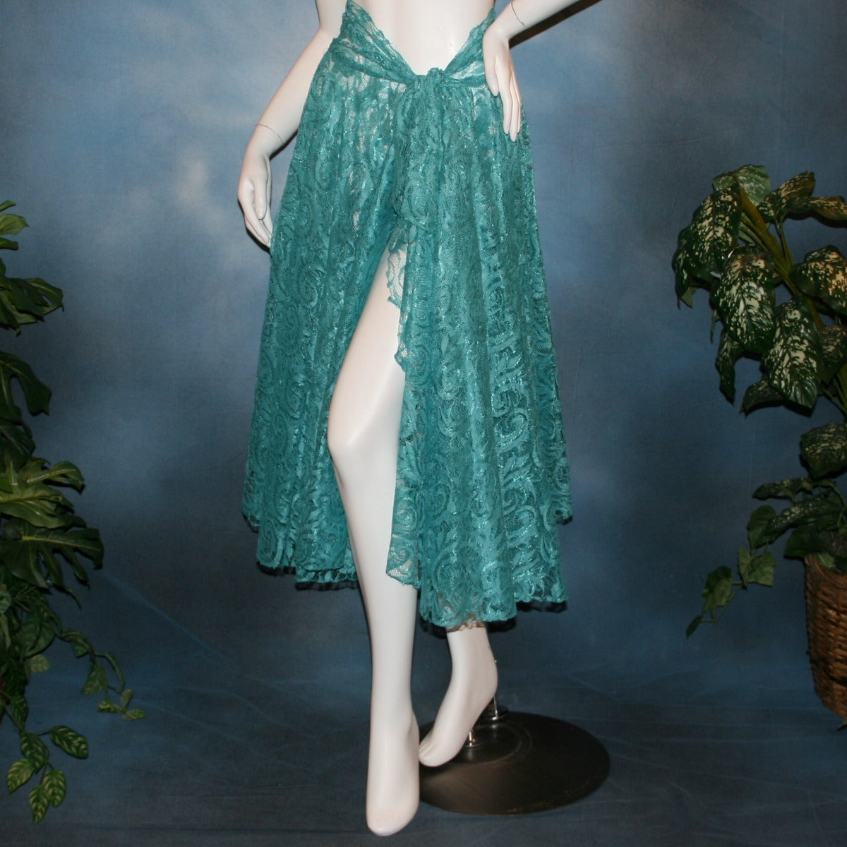 Aqua lace ballroom skirt, wrap style, was created with yards of aqua lace, many panels shaped like large petals.