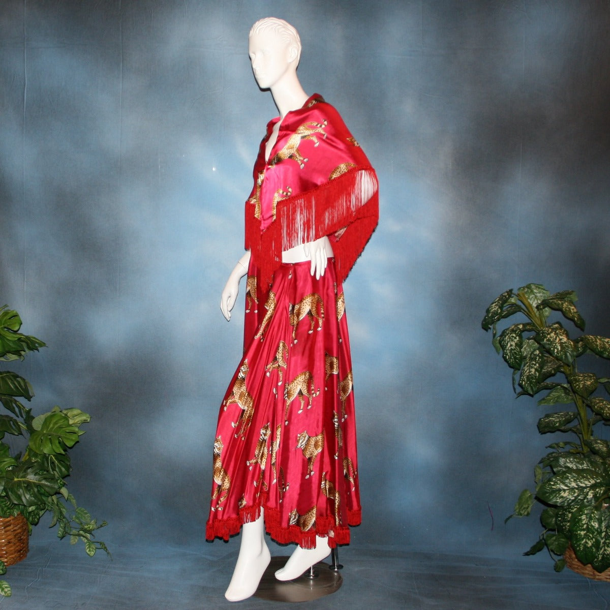 side view of Red full circle ballroom skirt with chainette fringe was created of red satin with cheetah print along with matching shawl to team with a bodysuit or top. I can envision custom creating a body suit of cheetah fabric to team with this...actually would be fun to create a few to mix & match with this ballroom skirt set...some with Swarovski work!!
